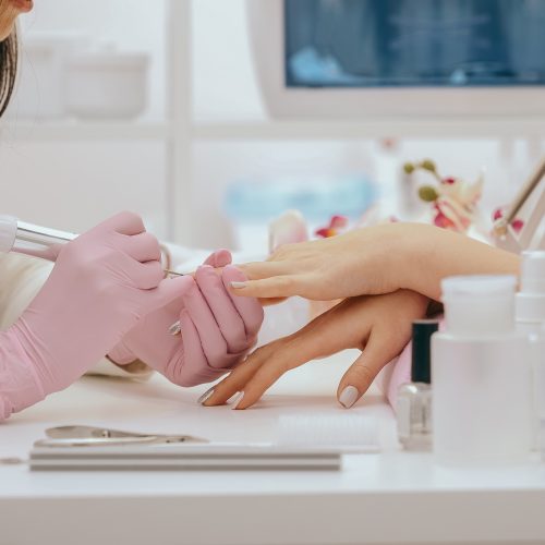 Manicurist with a milling cutter for manicure